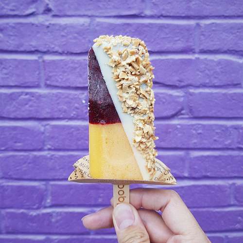 united states person holding popsicle stick lolly